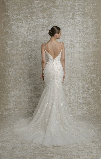 All over beaded 3D floral trailing sequinned lace, deep V neckline, thin straps, illusion cutouts under arms, fit to flare, low V back, zip closure with decorative buttons, chapel train.