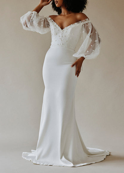 Satin gown with sweetheart neck and pearl cluster lace bodice overlay with bishop sleeves - front view