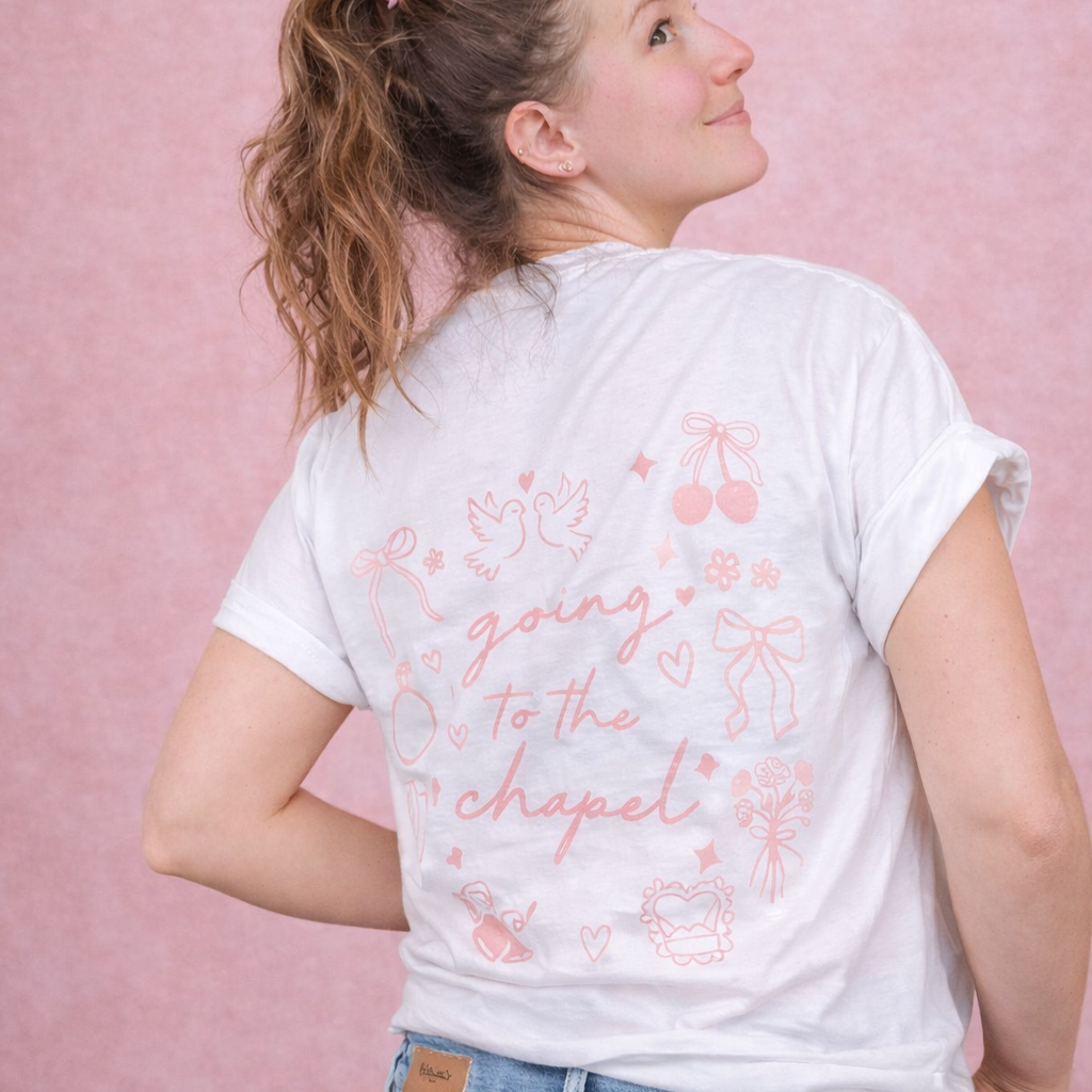 Abby wearing a white t-shirt with pink text "going to the chapel" and wedding graphics on a pink background