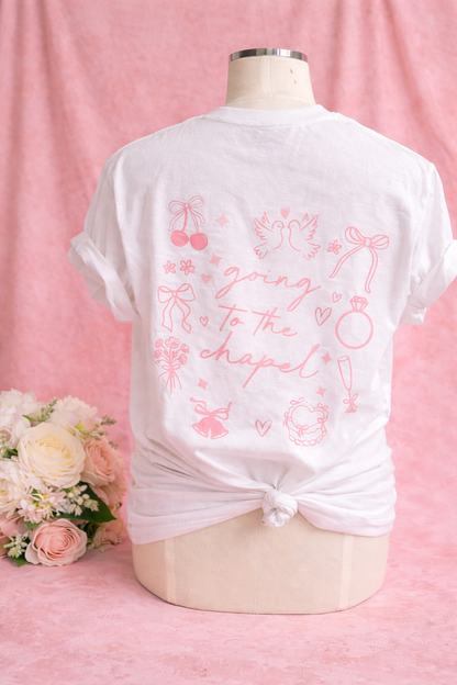 mannequin wearing a white t-shirt with pink text "going to the chapel" and wedding graphics on a pink background