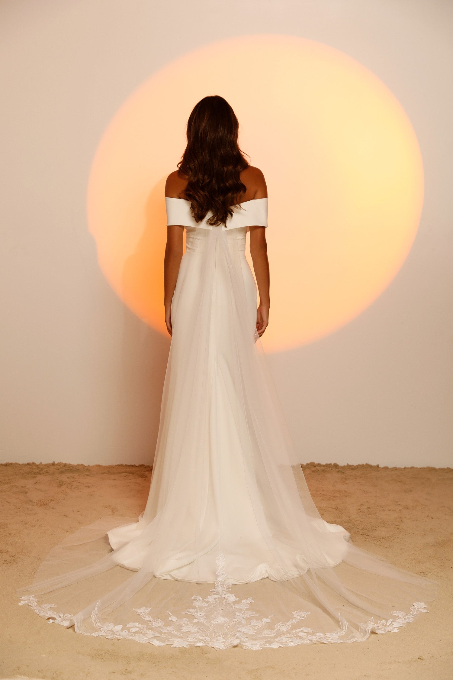 Full body of Jaye - a crepe fitted gown with off the shoulder sleeves