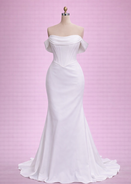 A stunning satin back crepe fitted gown with corseted bodice and baby basque waist.