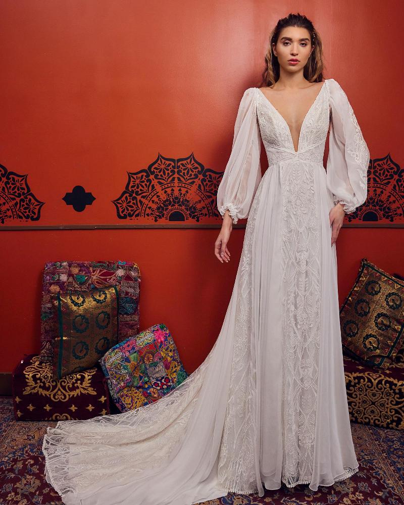 Woman wearing a longsleeve wedding dress full lace - full body front view