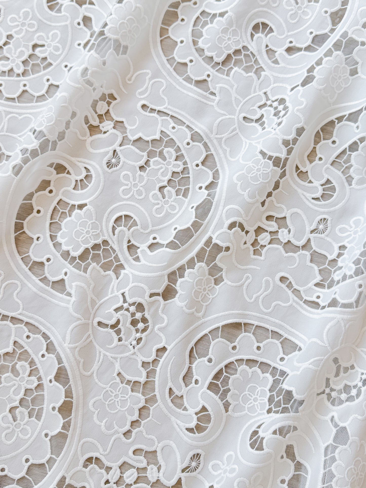 Closeup of the floral ornament lace of the LARKIN wedding dress