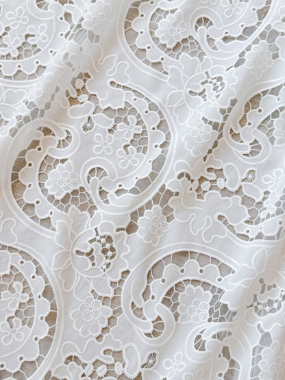 Closeup of the floral ornament lace of the LARKIN wedding dress