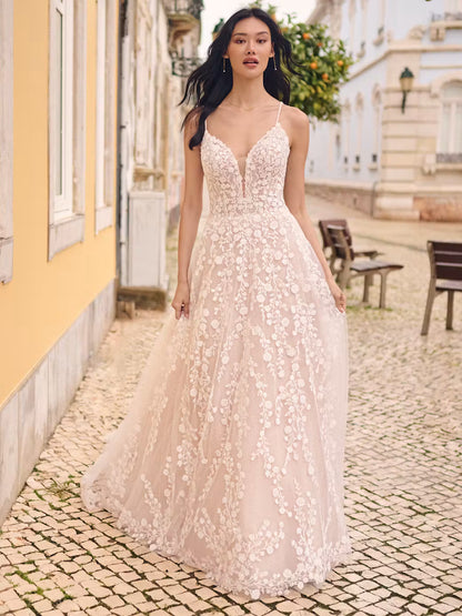 Sequin lace motifs over sparkle tulle
Sheer organza lined bodice
Plunging V-neckline
Deep sheer organza lined back bodice
Beaded spaghetti straps
Covered button over zipper closure