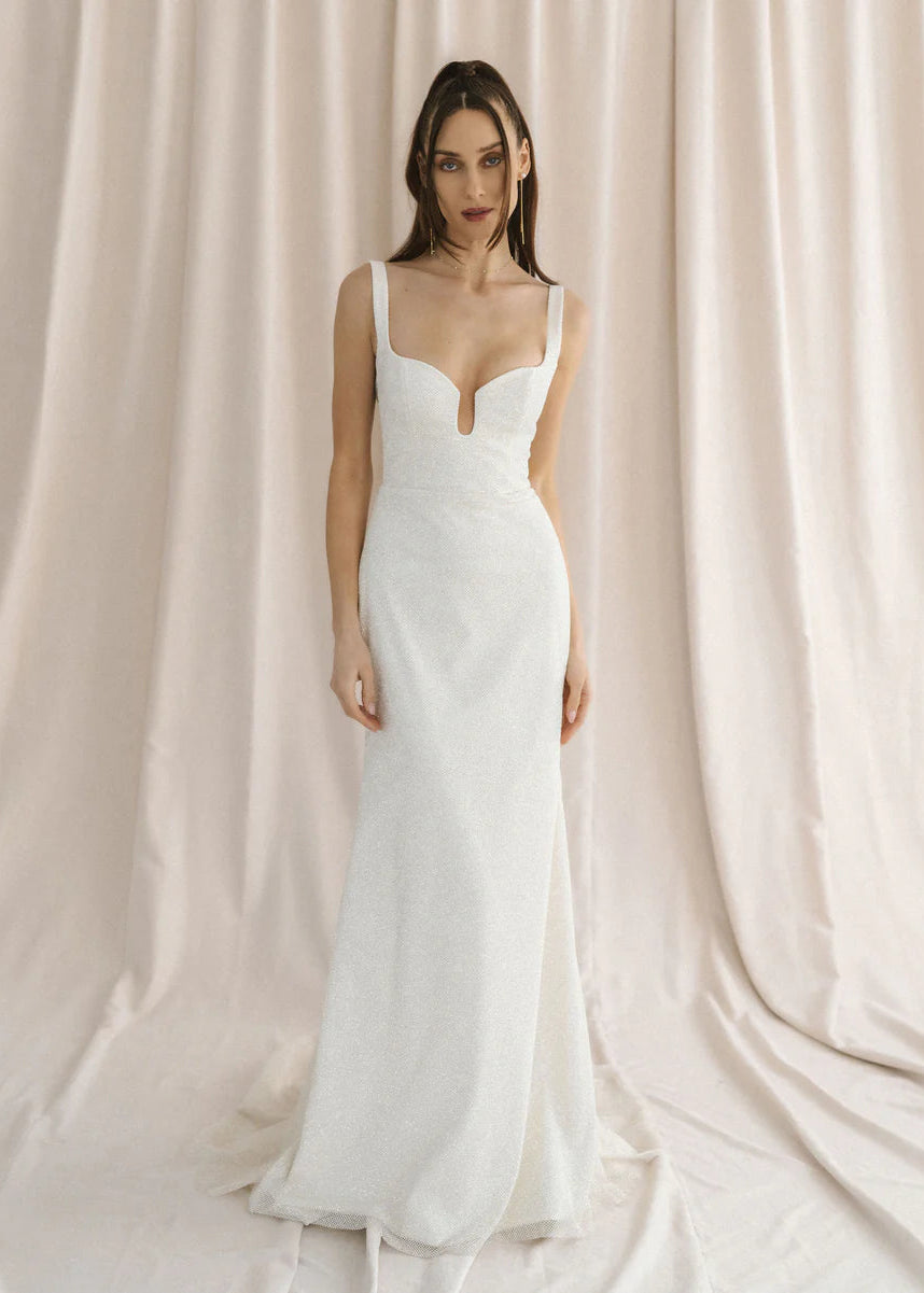 A sparkly champagne tulle wedding gown with a unique u-wire neckline and illusion back - full body front view