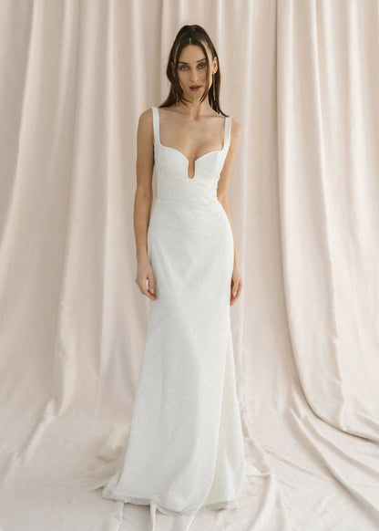 A sparkly champagne tulle wedding gown with a unique u-wire neckline and illusion back - full body front view