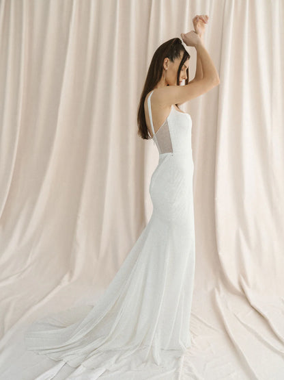 A sparkly champagne tulle wedding gown with a unique u-wire neckline and illusion back. - full body side view