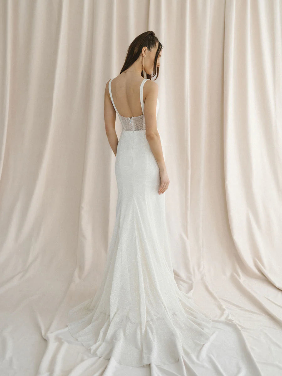 A sparkly champagne tulle wedding gown with a unique u-wire neckline and illusion back - full body back view
