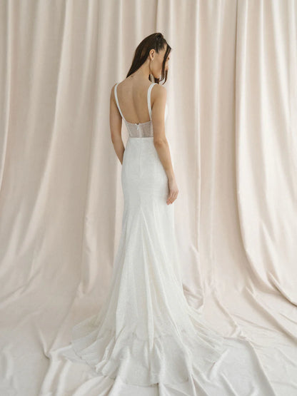 A sparkly champagne tulle wedding gown with a unique u-wire neckline and illusion back - full body back view
