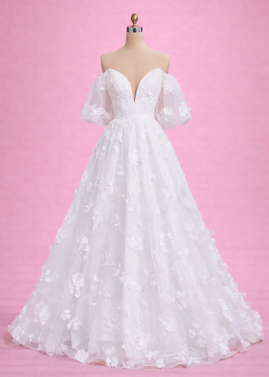 Marigold is everything you want your dress to be! Whimsical with it's 3D flowers, chic with it's puffy sleeves, and sultry with it's plunging neckline.