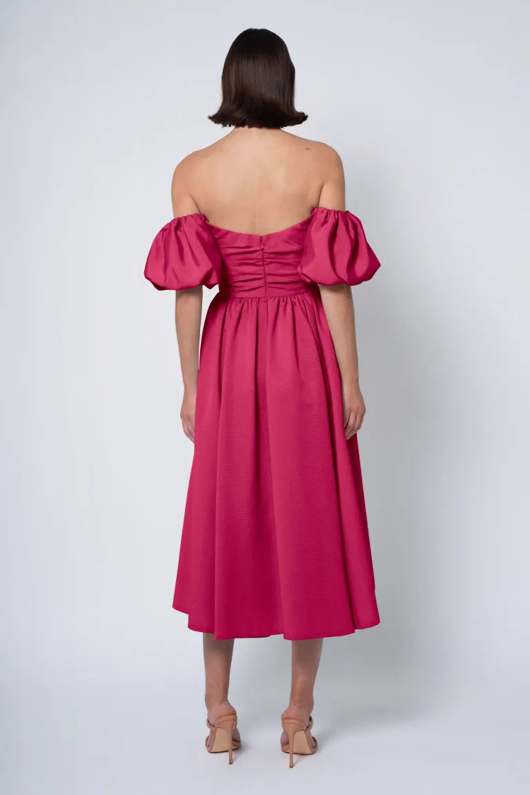 The Regina dress in our luxurious faille is a fashionable and&nbsp;versatile&nbsp;choice for any occasion. It boasts a pleated bodice with a streamlined, straight strapless neckline, removable puff sleeves, a playful midi-length dirndl skirt, and everyone’s favorite — pockets!