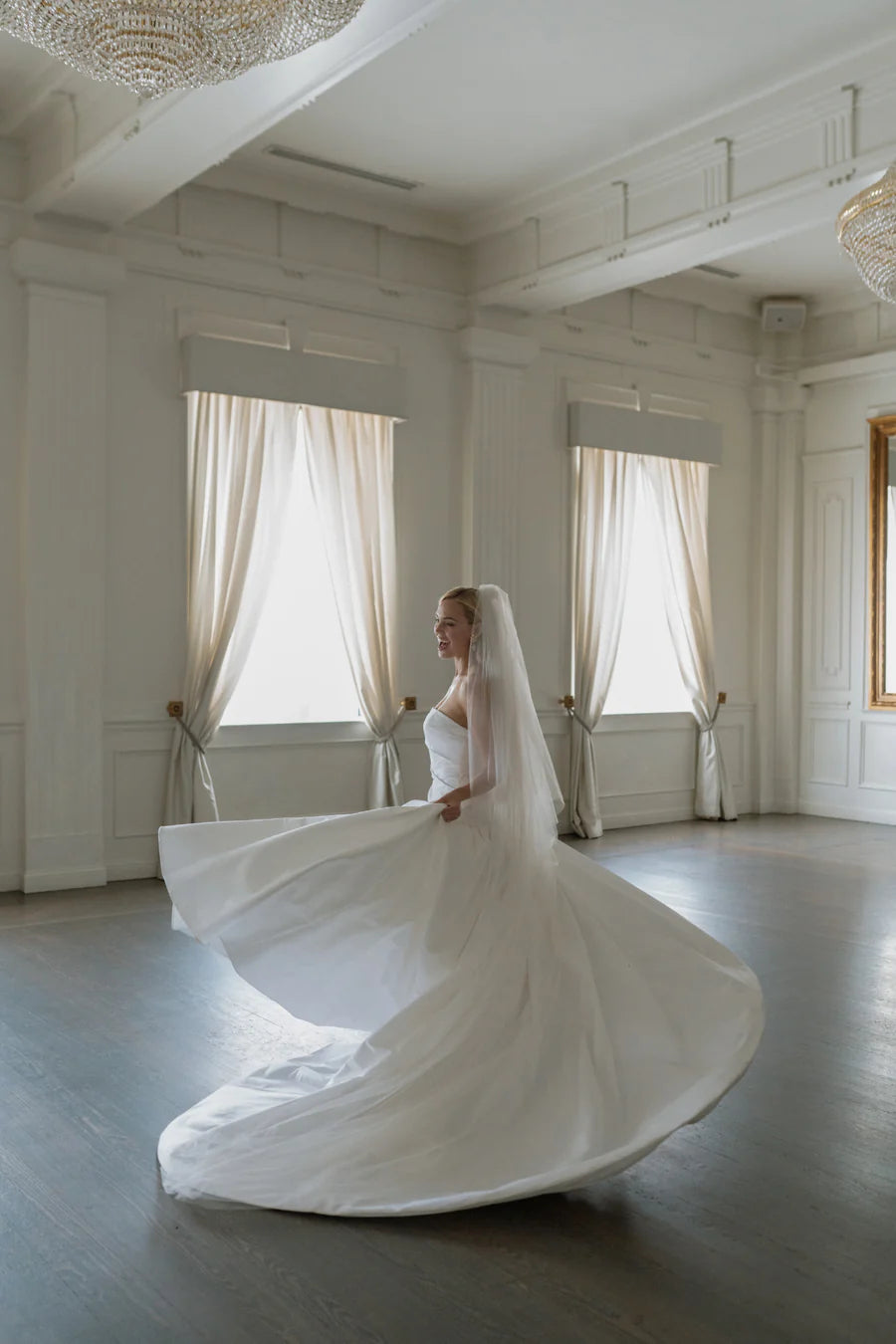 The show stopping Parvati gown with a dropped waist ballgown is what bridal dreams are made of. Corset construction for security and a flattering bodice. With a straight neckline, and oh did we mention, she has pockets!