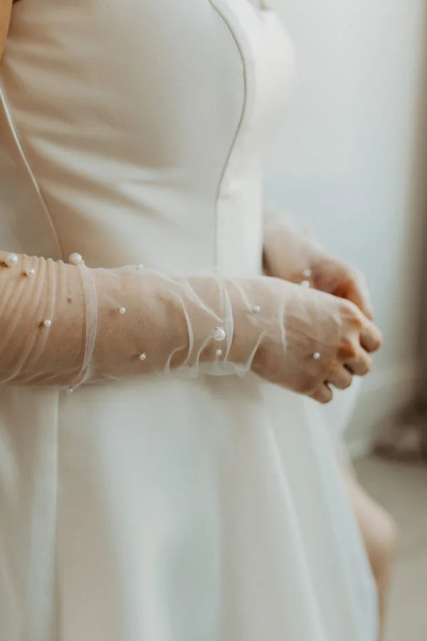 Woman wearing beaded tulle fingerless gloves