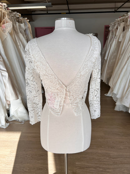 White lace dress topper, rose vintage lace on a mannequin with a v-back and 4 matching satin buttons.