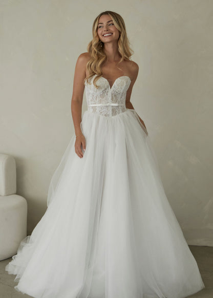 Manette, a delicate chantilly lace sweetheart bodice with a full tulle skirt