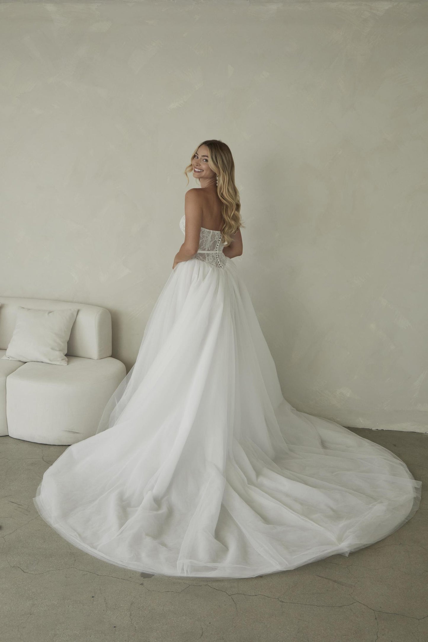 Manette, a delicate chantilly lace sweetheart bodice with a full tulle skirt