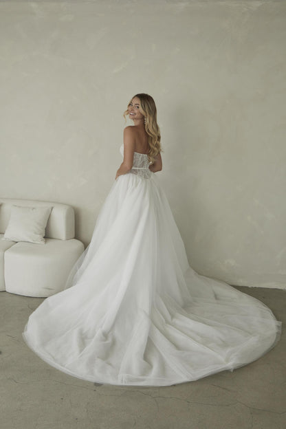 Manette, a delicate chantilly lace sweetheart bodice with a full tulle skirt