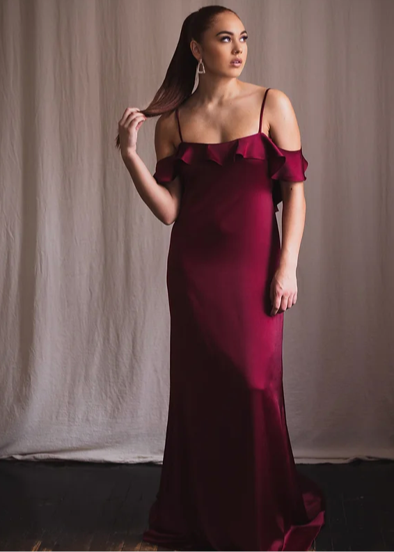 Woman wearing an off the shoulder red dress