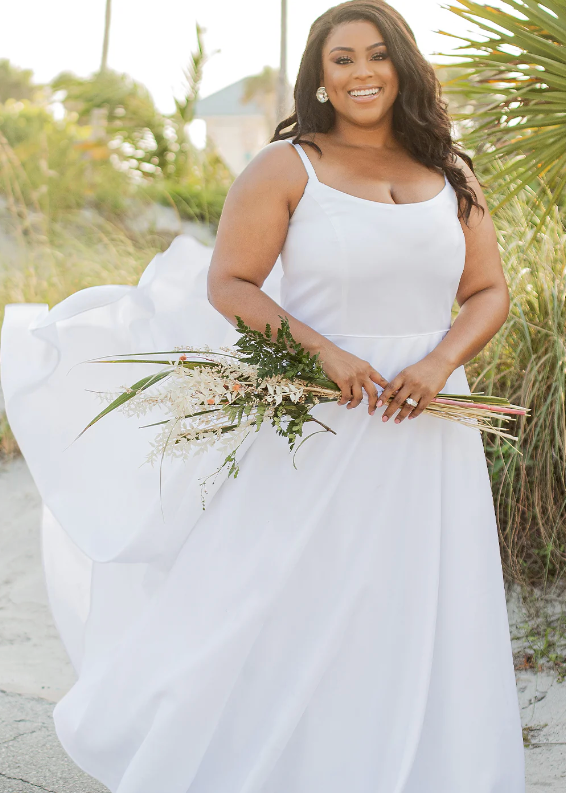 Woman wearing a plain wedding dress in white