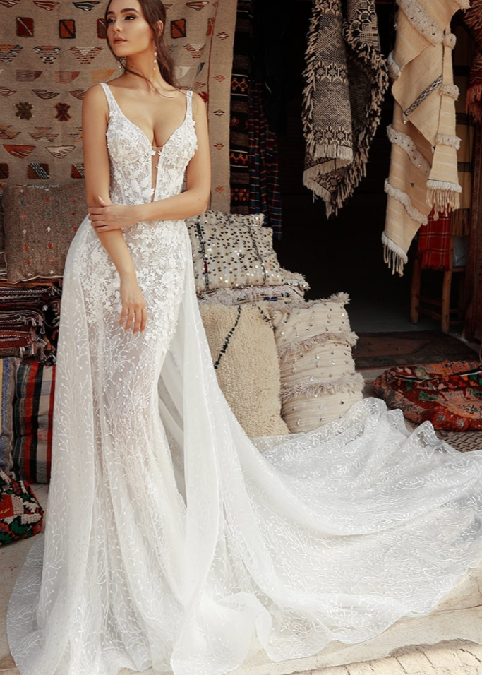 Woman wearing a white wedding dress with full lace details