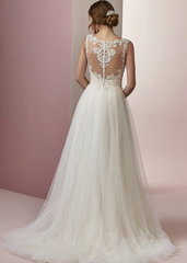 Woman wearing a halter neck a line wedding dress - back view