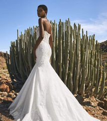 Model wearing Finglas by Pronovias - full lace and beaded mermaid wedding dress full body back view