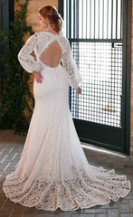 Model wearing D3443 by Essence of Australia - a long sleeve full lace fit and flare wedding dress,  full body back view with keyhole back