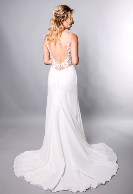 Meet Andrea, a non-fuss breath of fresh air fit and flare gown with hints of lace. - full body back view