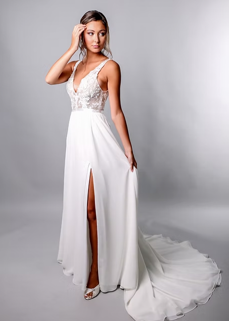 Shauna's a-line silhouette has a soft crepe skirt, artistic lace top and seamless side slit - full body front view