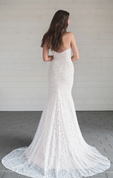 A captivating full lace fit and flare wedding gown with a sweetheart neckline, slight v-back, a beautiful long train, and a graceful godet detail- full body back view