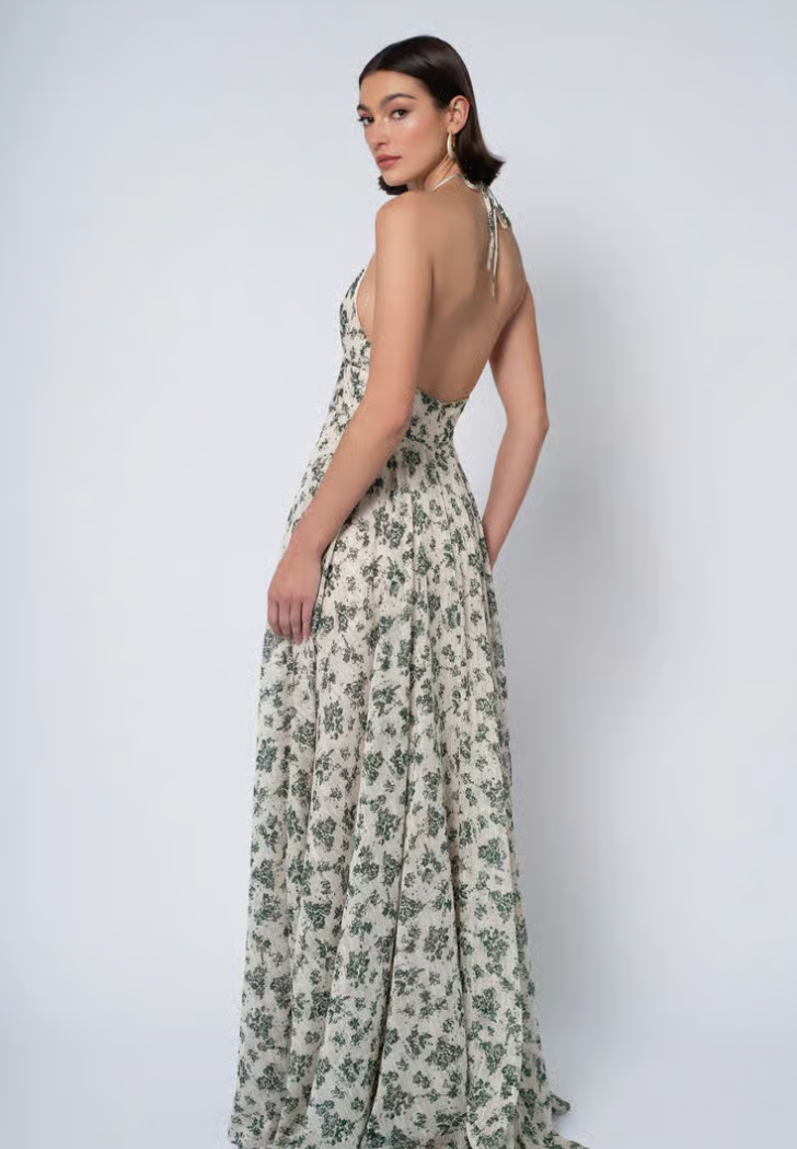 Woman wearing a floral dress with a white background