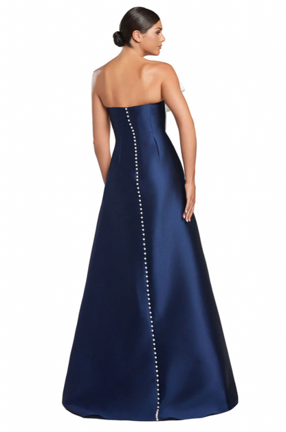 Navy strapless gown with pearl detailing on a white background