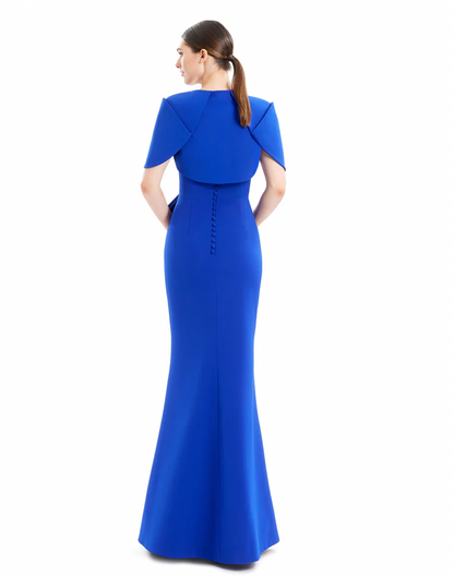 Woman wearing a blue evening gown on a white background