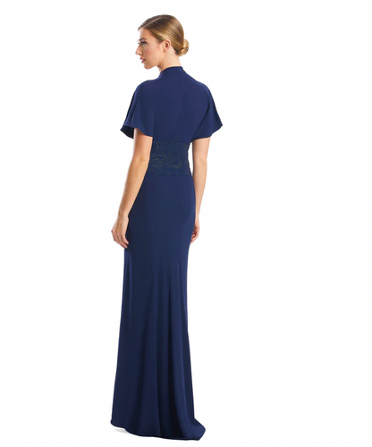 Woman wearing a navy blue evening gown on a white background