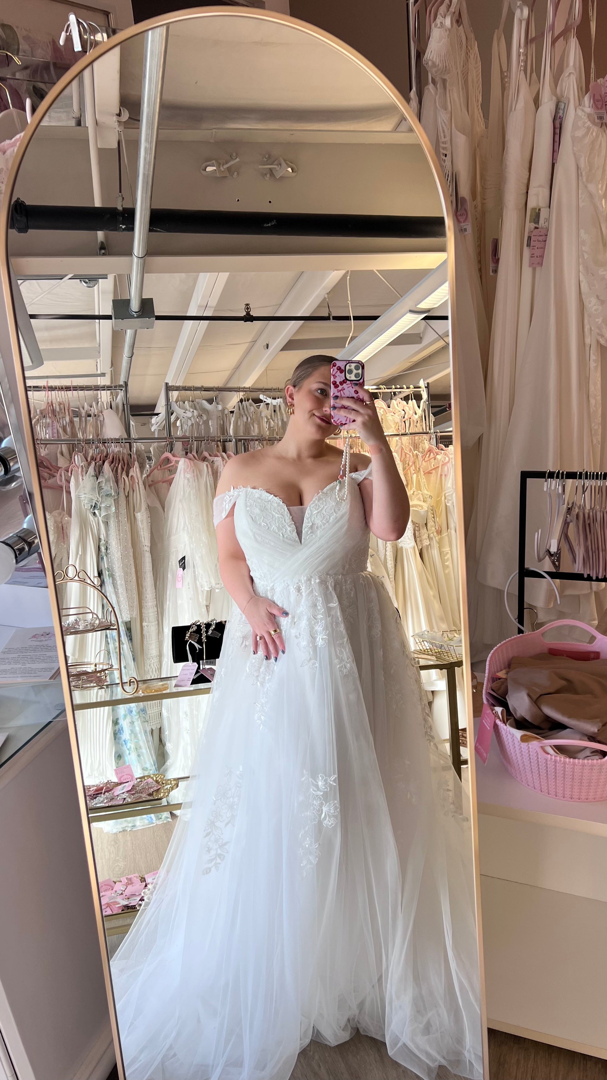 Lizzie wearing the Sylvia wedding dress, strapless off the shoulder aline lace tulle gown