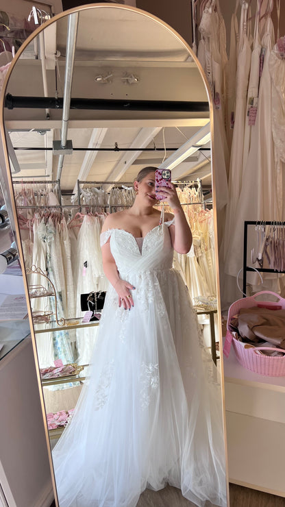 Lizzie wearing the Sylvia wedding dress, strapless off the shoulder aline lace tulle gown