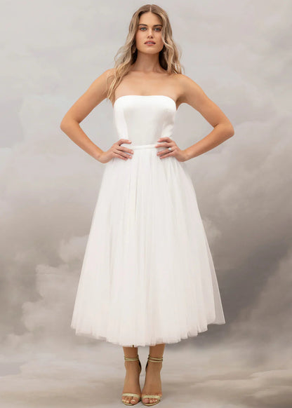 Add a touch of whimsy to your wedding day look with the fun and flirtatious Talulla skirt. This midi length, soft tulle skirt features a silk satin waistband.