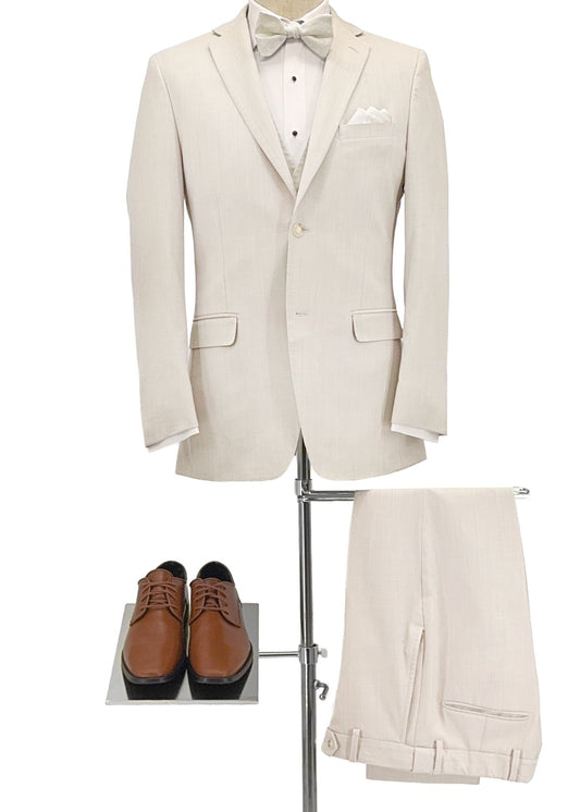 Beige suit with bow tie, white shirt, and brown shoes on a stand against a white background