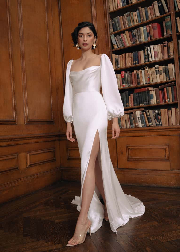 The Luciana gown evokes a feel of old Hollywood. Featuring a sultry cowl neckline and sumptuously oversized sleeves that can be worn on or off the shoulder.