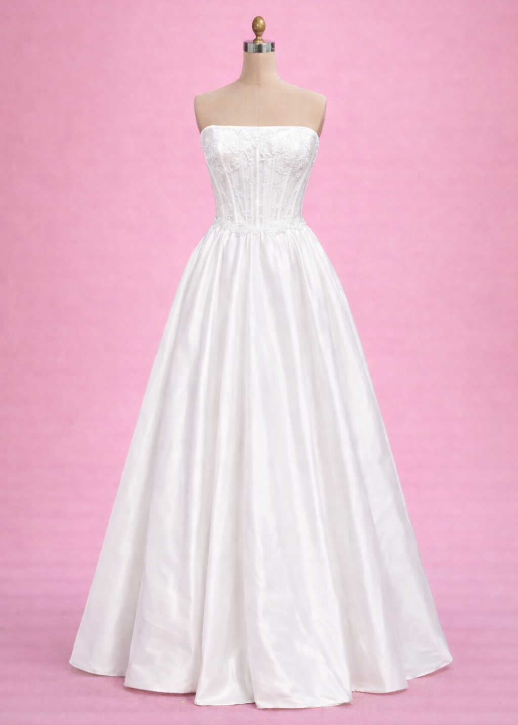 Veronica is a dashing floor length gown with a structured corset bodice, lace along the top and a full taffeta skirt.