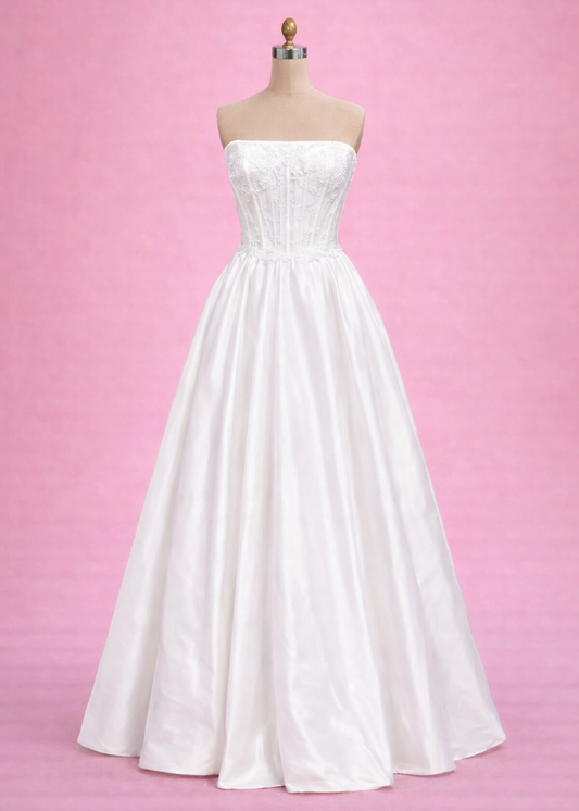 Veronica is a dashing floor length gown with a structured corset bodice, lace along the top and a full taffeta skirt.