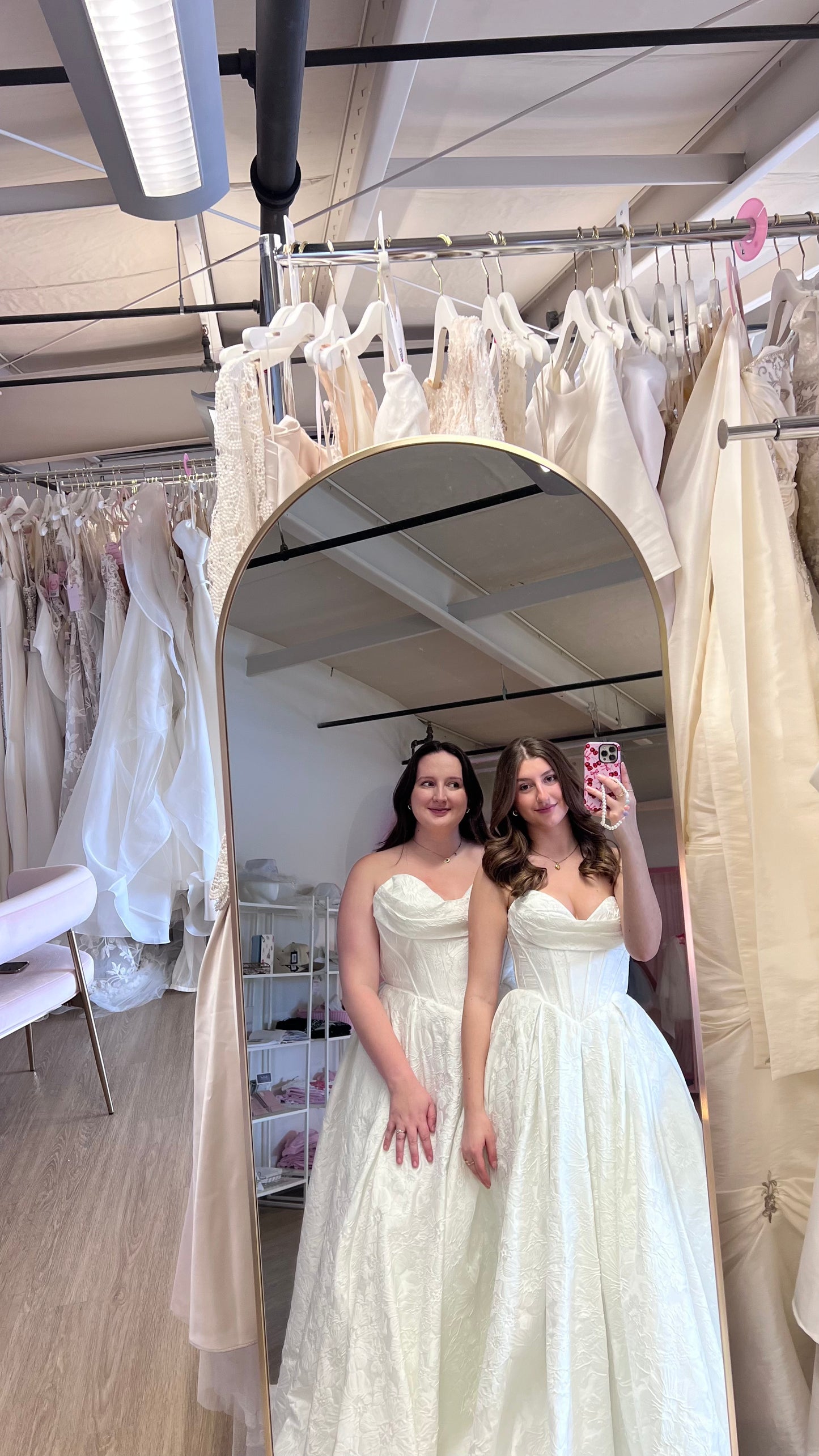Olivia and Dali wearing the Violetta Basque A-Line wedding dress