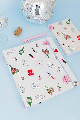 White kate spade planner with small wedding graphics