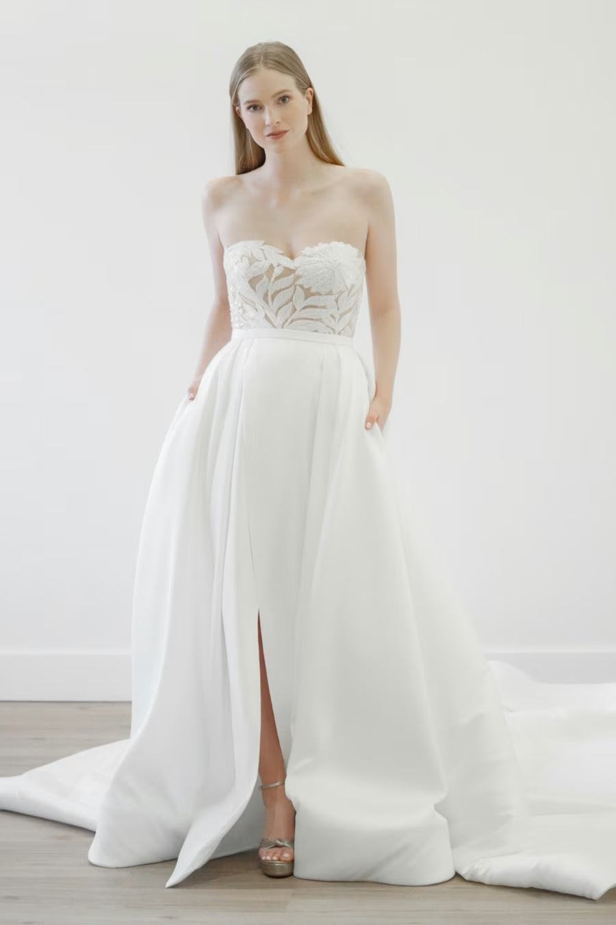 Fun and flirty, the June gown offers you two looks in one. A custom beaded mini dress is paired with this stunning Mikado and Organza overskirt.