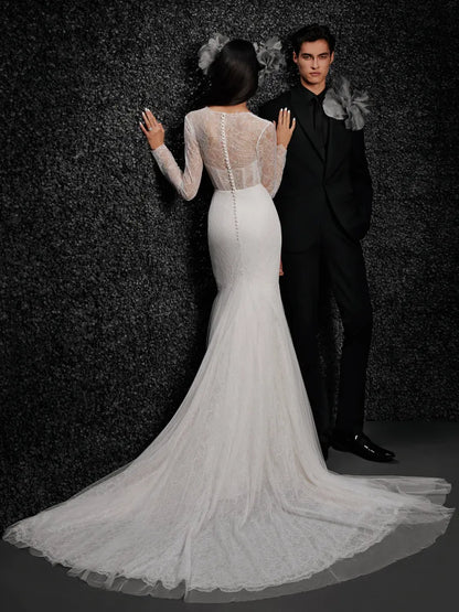 Model wearing Monique by Vera Wang - a mermaid lace wedding dress with long sleeves and a deep V,, full body back view