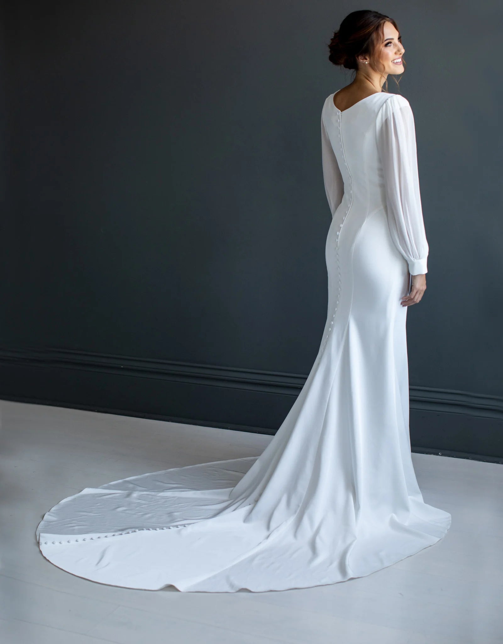 Full body back view of Courtney by The Modest Bride