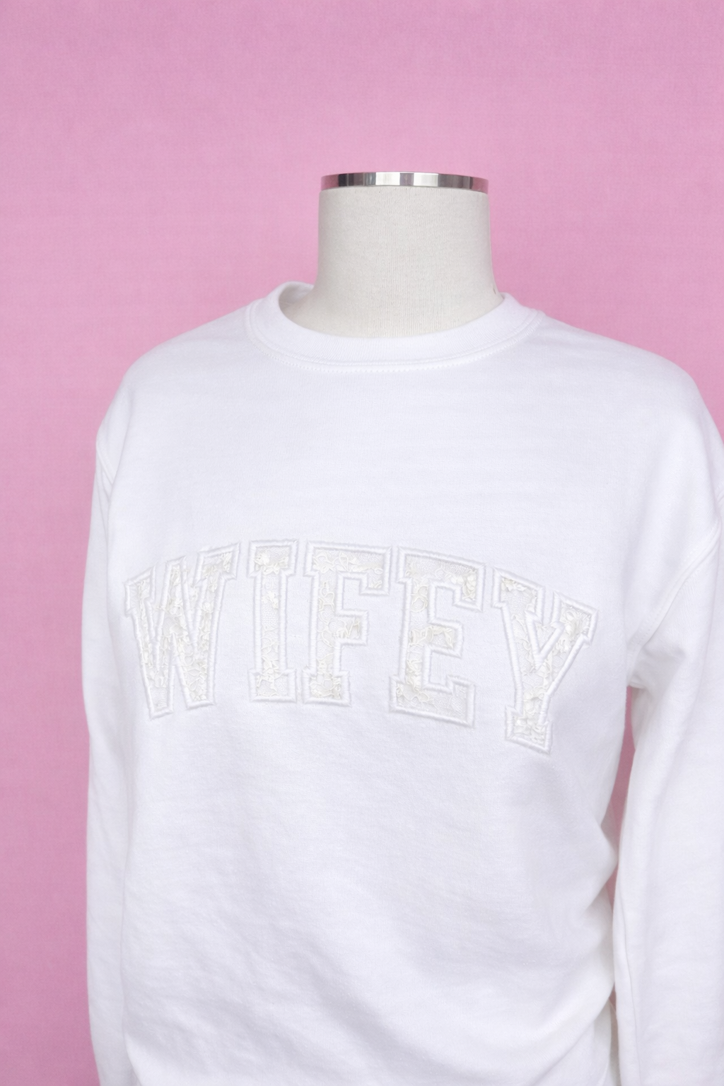 White sweatshirt with 'WIFEY' text on a pink background, keepsake wedding dress. After the vows