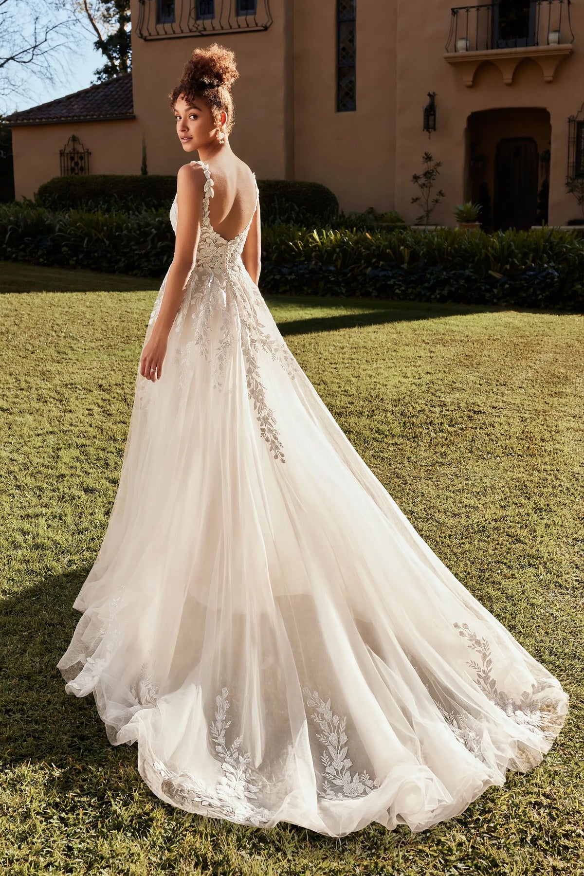 Back of Matilda A-Line wedding dress in lace featuring a low back at NKIN bridal boutique in Ottawa